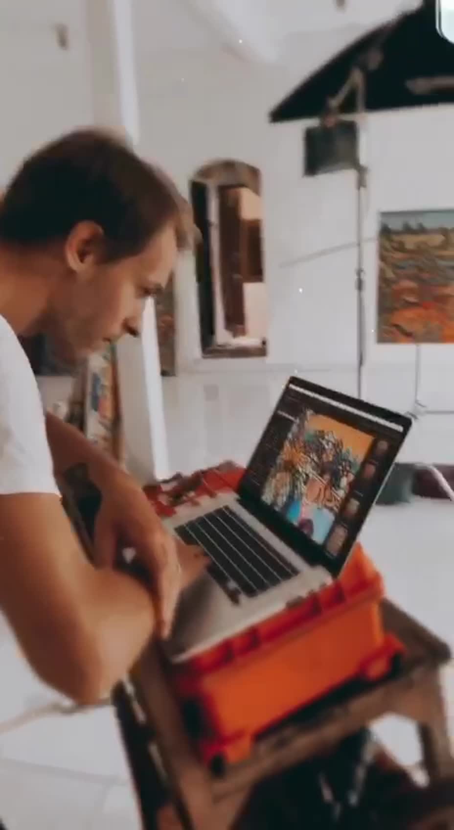 A painting film being reviewed on a laptop during production.