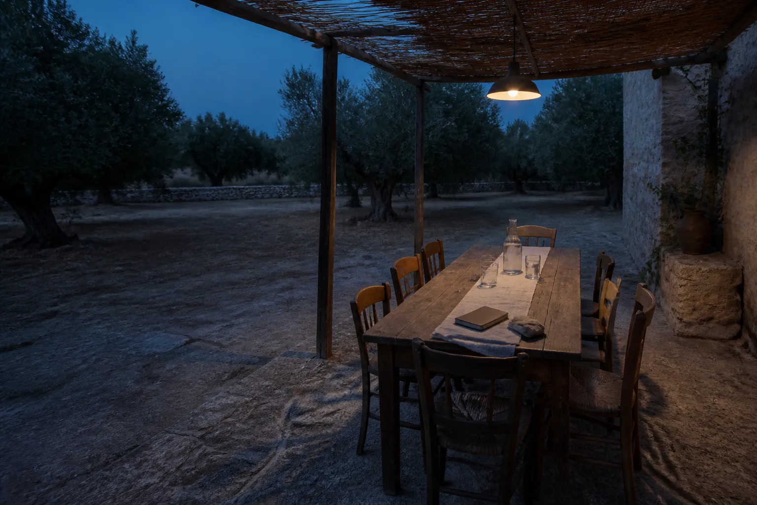 Editorial visualisation of an empty table under olive trees at blue hour