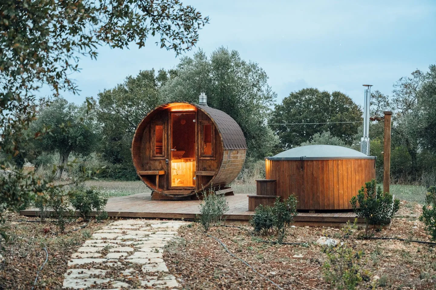 Wood-fired sauna and hot tub among olive trees