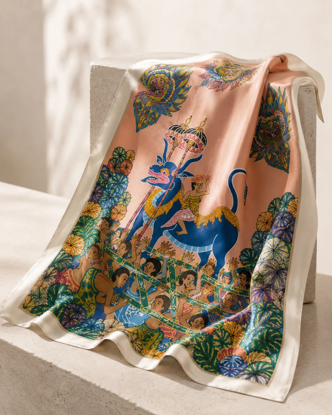 Peach procession silk draped over a pale stone block in soft directional light